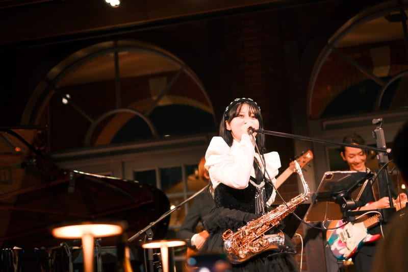 Midnight Performance: Saxophone and Vocals Under Glass