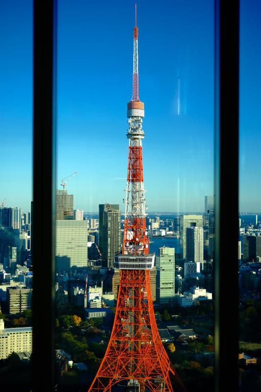 Tokyo Tower Through Modern Glass