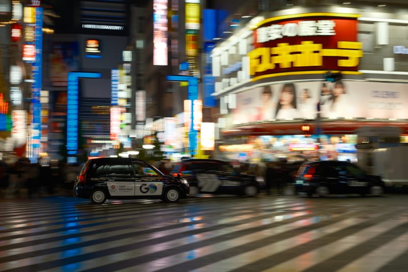 Neon Crosswalk: Tokyo's Electric Night