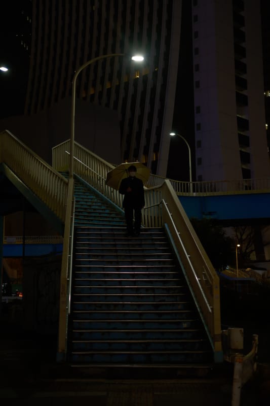 Solitary Ascent Through Urban Night